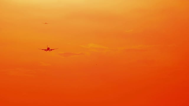 videoblocks-bright-sunny-orange-sunset-sky-with-flying-airplanes-travel-background_bngn5m0uhf_thumbnail-full03.png